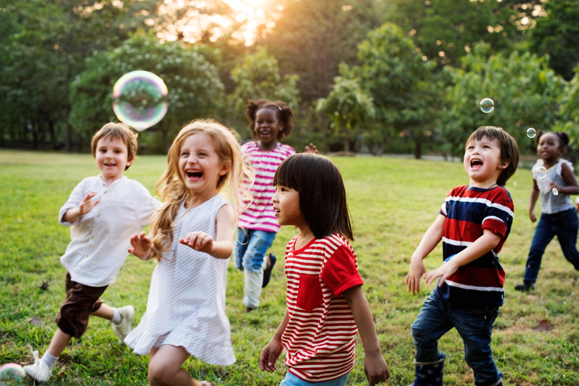 Group of Diverse Kids Playing at the Field Together