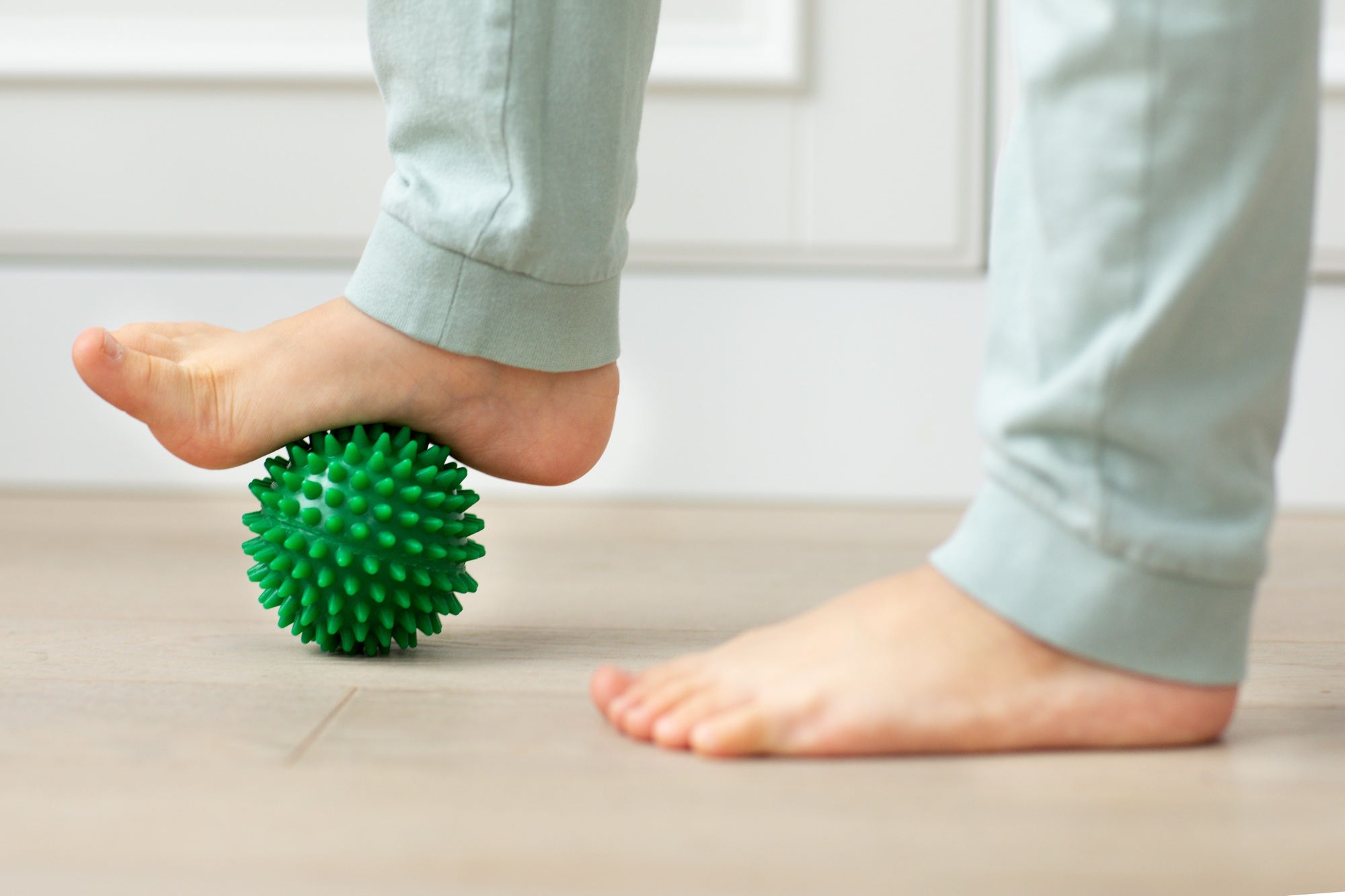 kid holding massage ball physical therapy and massage for development neuro psychology