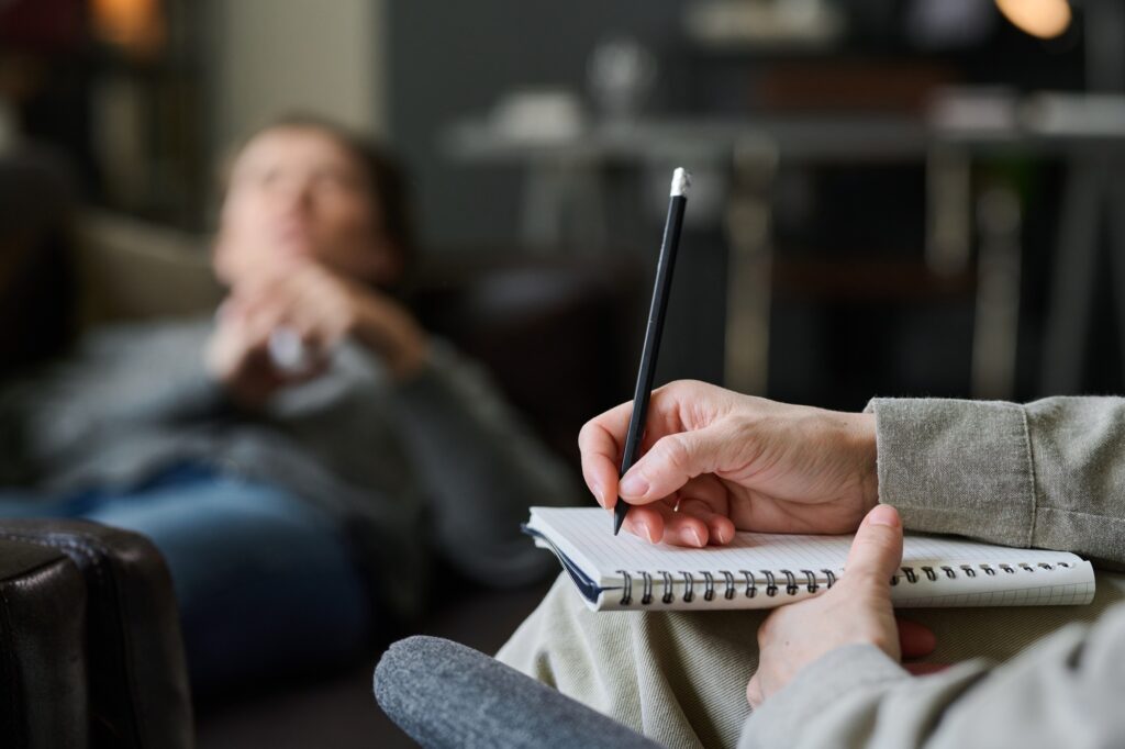 Child showing early signs of autism while receiving support from an ABA therapist.
